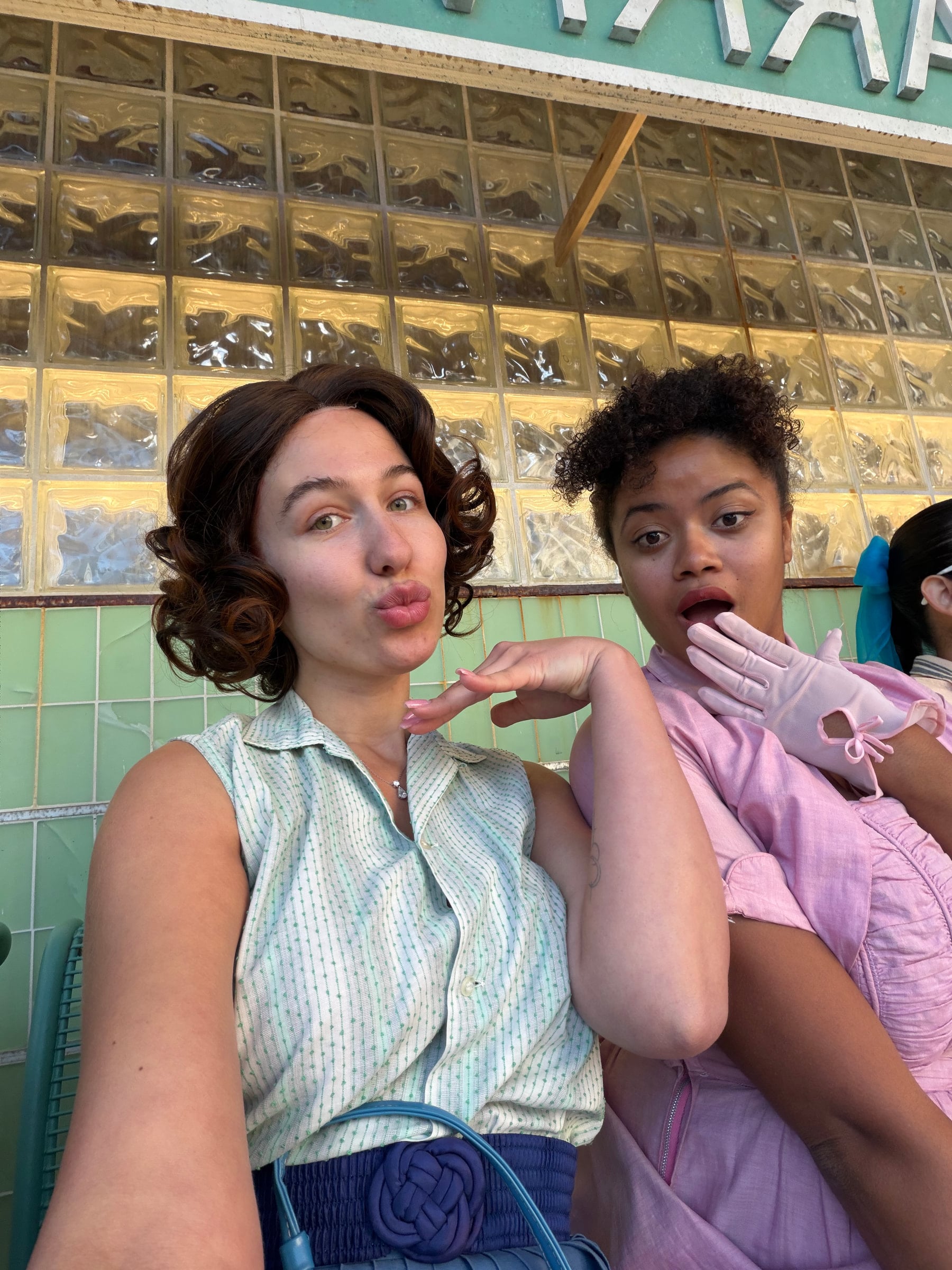 Iryna Vyacheslavivna posing with another performer in vintage styling on set