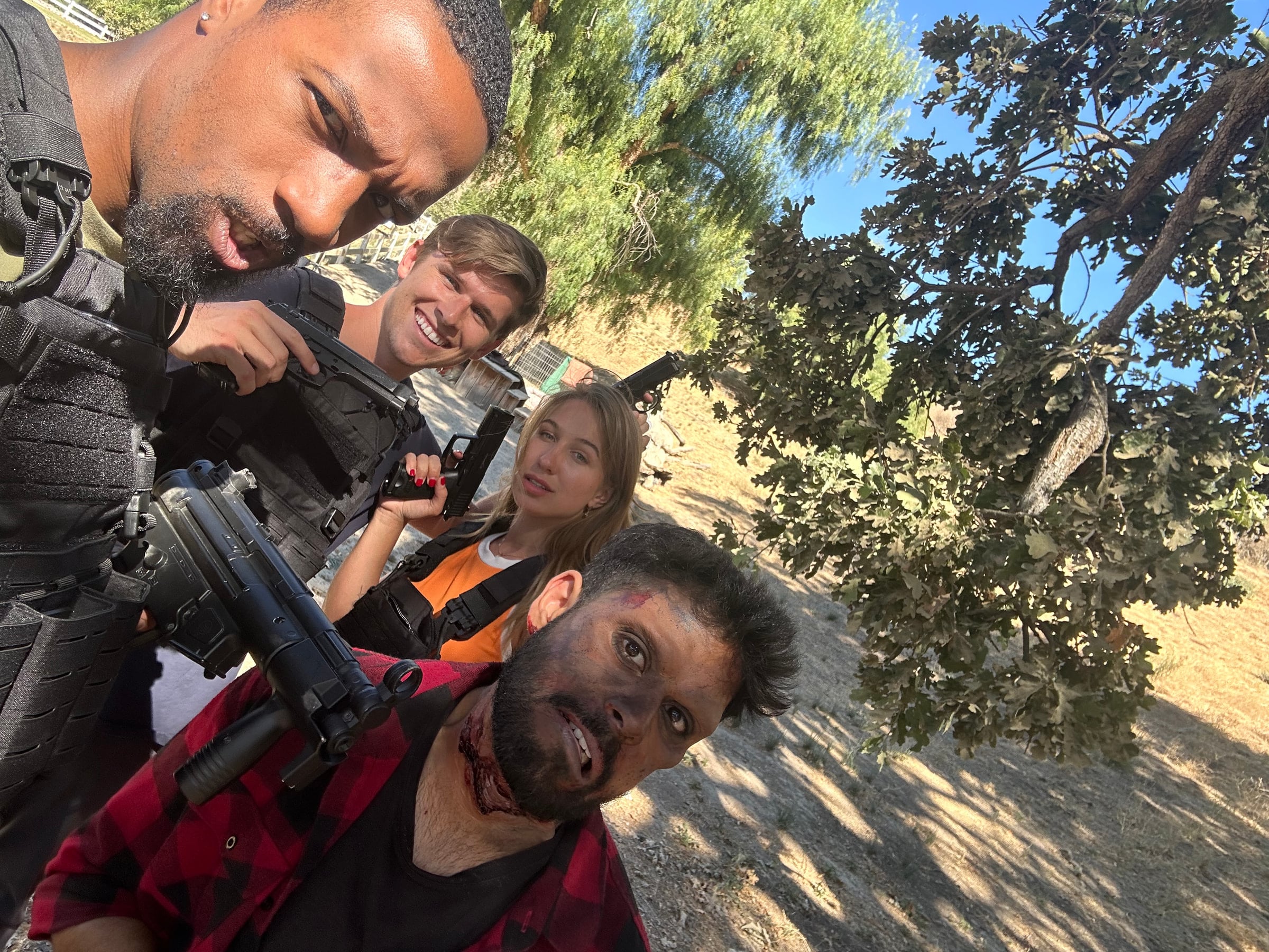 Iryna Vyacheslavivna taking a group selfie with a film crew outdoors